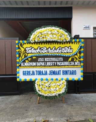 Papan Bunga Duka di Penengahan Raya